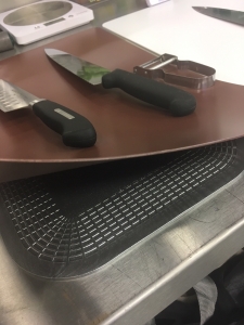 Chef uses Dycem Non-Slip Mat under chopping board